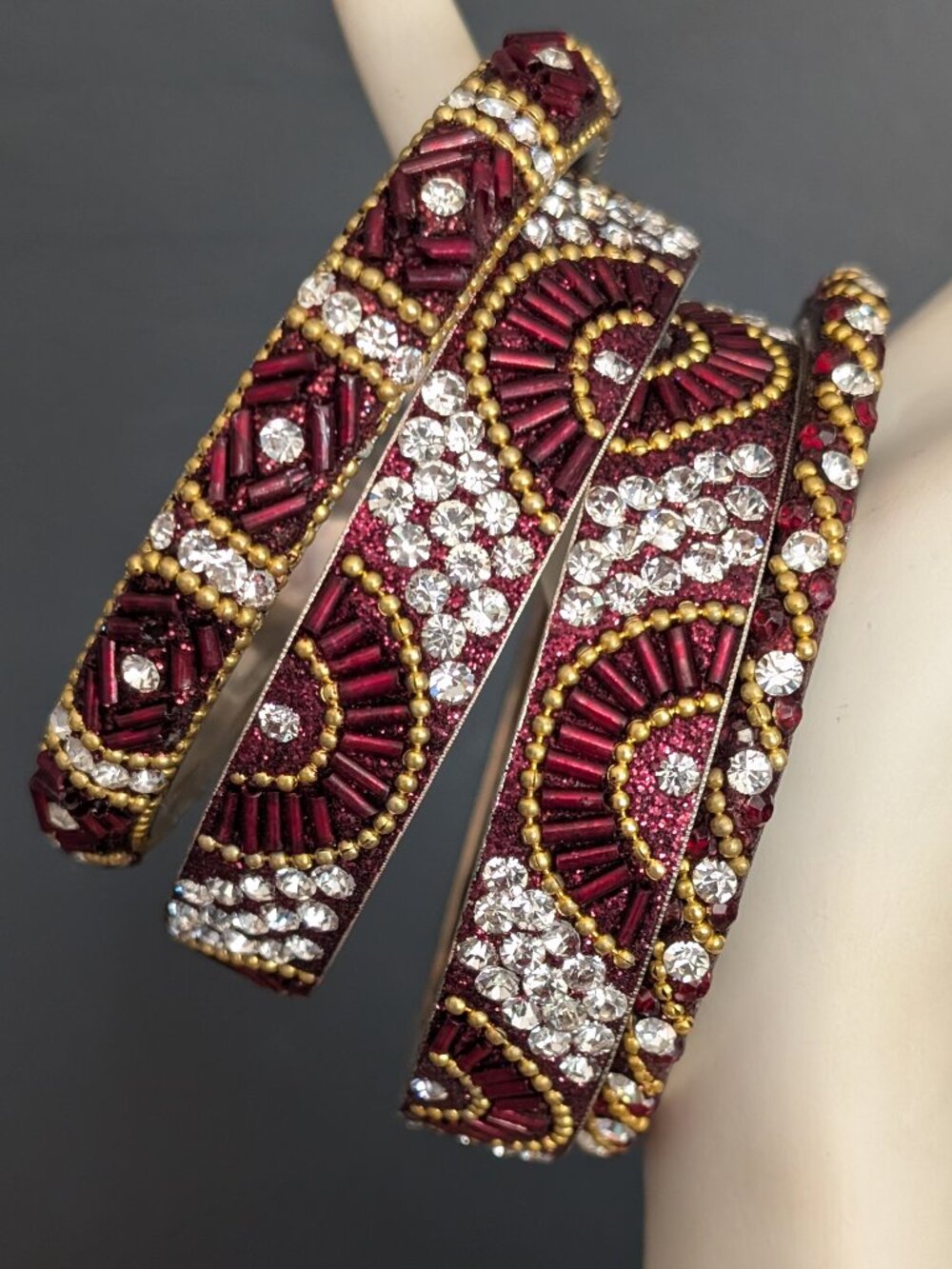 Bundle of 4 deep red, gold and clear beaded sparkly stacking bangles